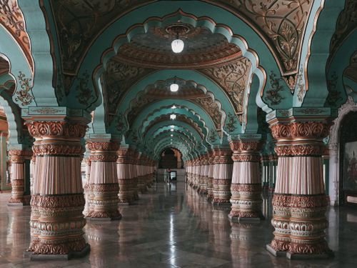 Free Explore the ornate and colorful corridors of Mysore Palace, a prime example of Indo-Saracenic architecture. Stock Photo