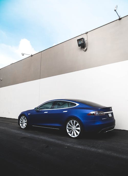 Free Blue Car On The Road Stock Photo