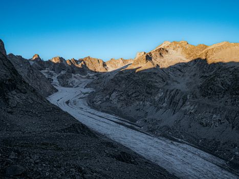Breathtaking view of Bregaglia glacier with rugged mountains at sunrise.
