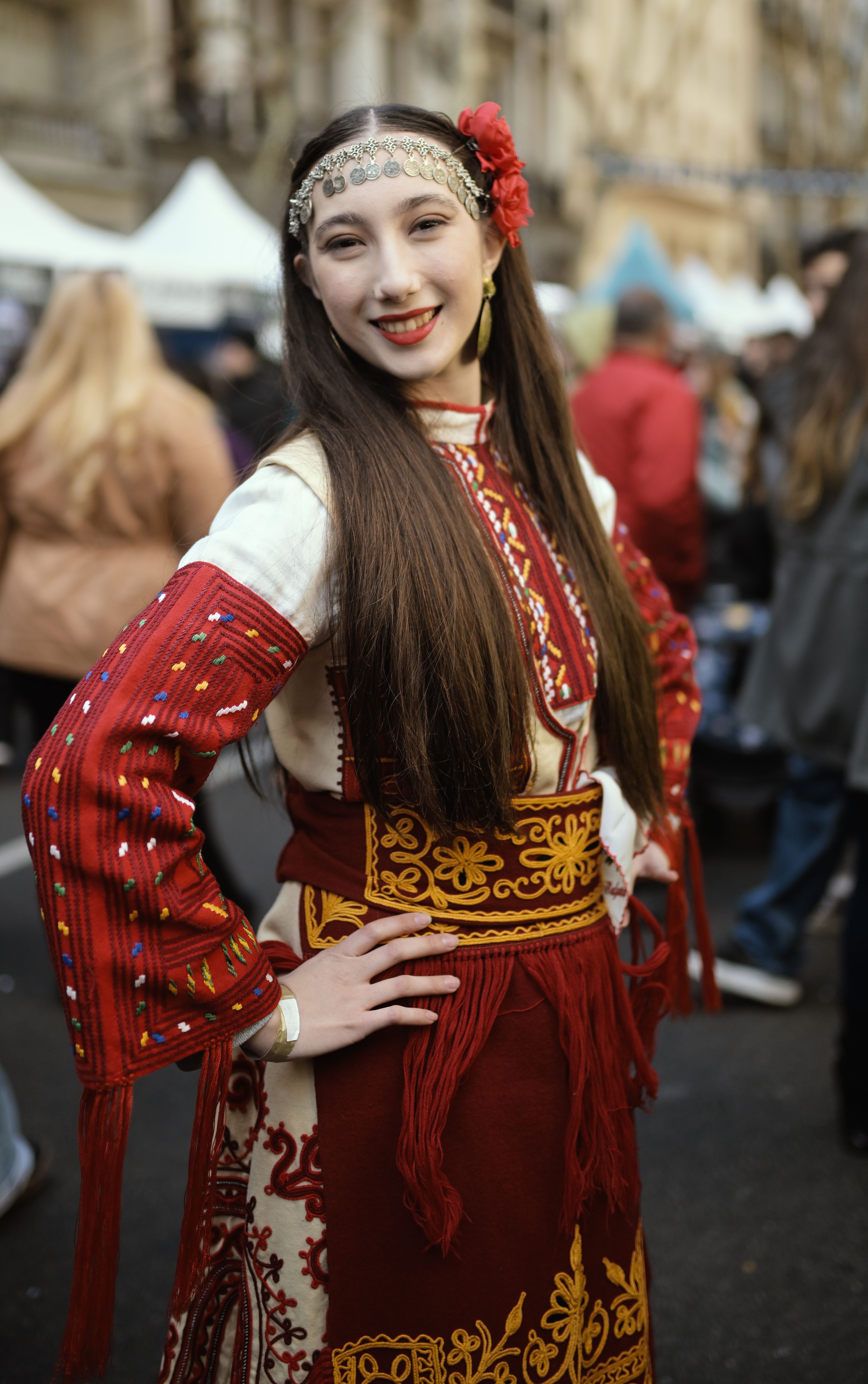Young woman in traditional attire participates in a cultural festival in Buenos Aires, Argentina.