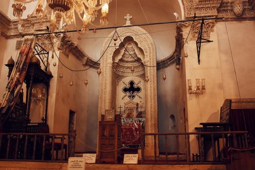 Free Explore the ornate architectural details and historic charm of a beautifully preserved synagogue interior. Stock Photo