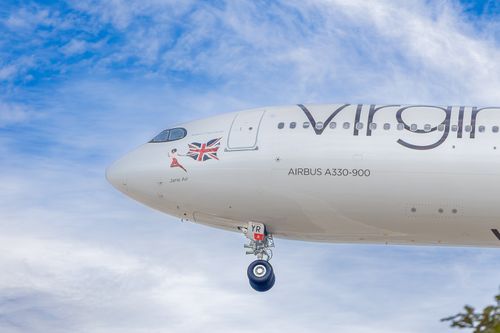 Free Close-up of Virgin Airbus A330-900 in flight, showcasing the Union Jack and sky backdrop. Stock Photo