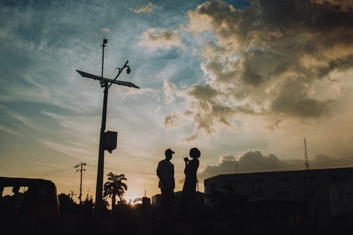 Free A romantic silhouette of a couple against a dramatic sunset in Kaduna, Nigeria. Stock Photo