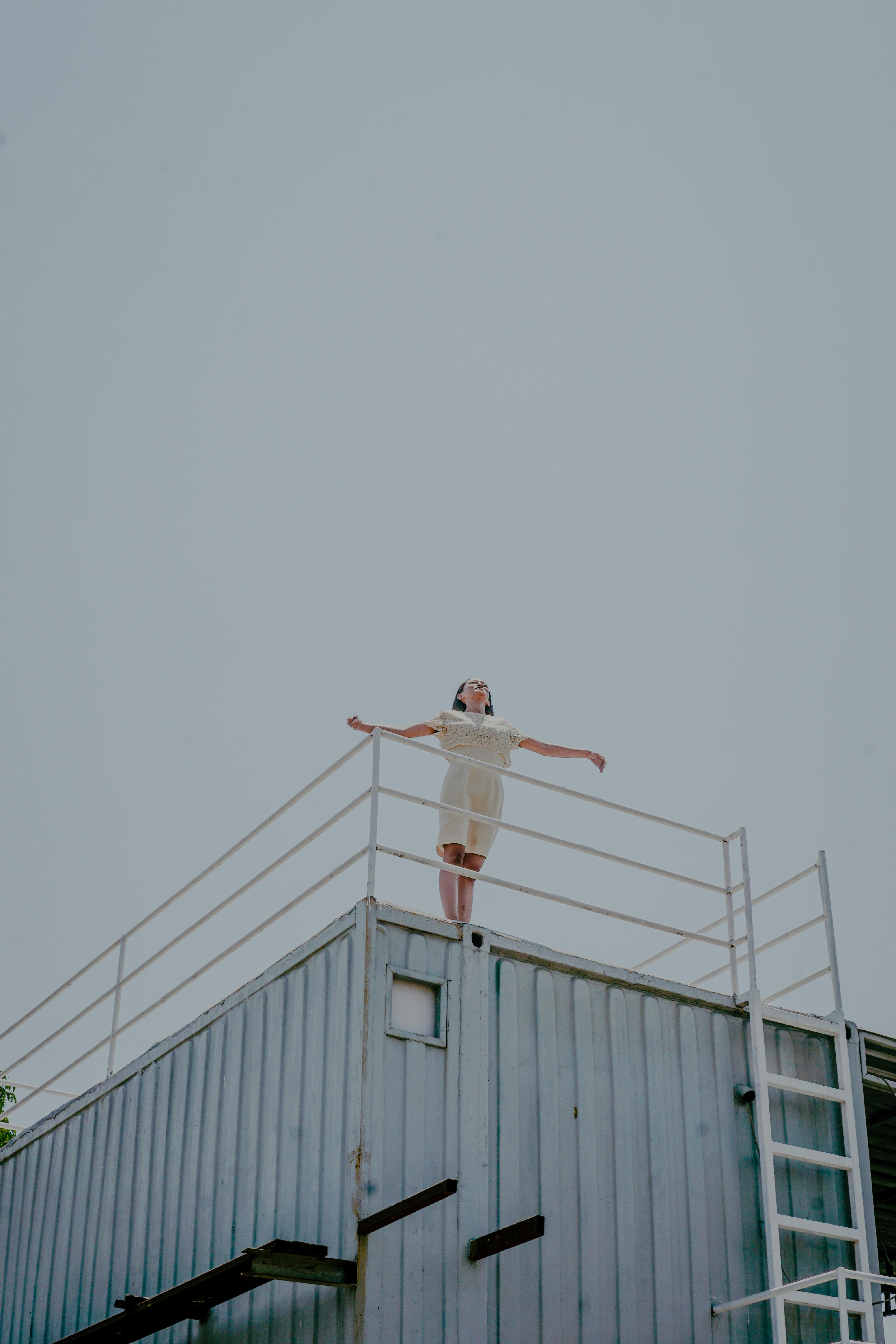 Person Standing On Roof · Free Stock Photo