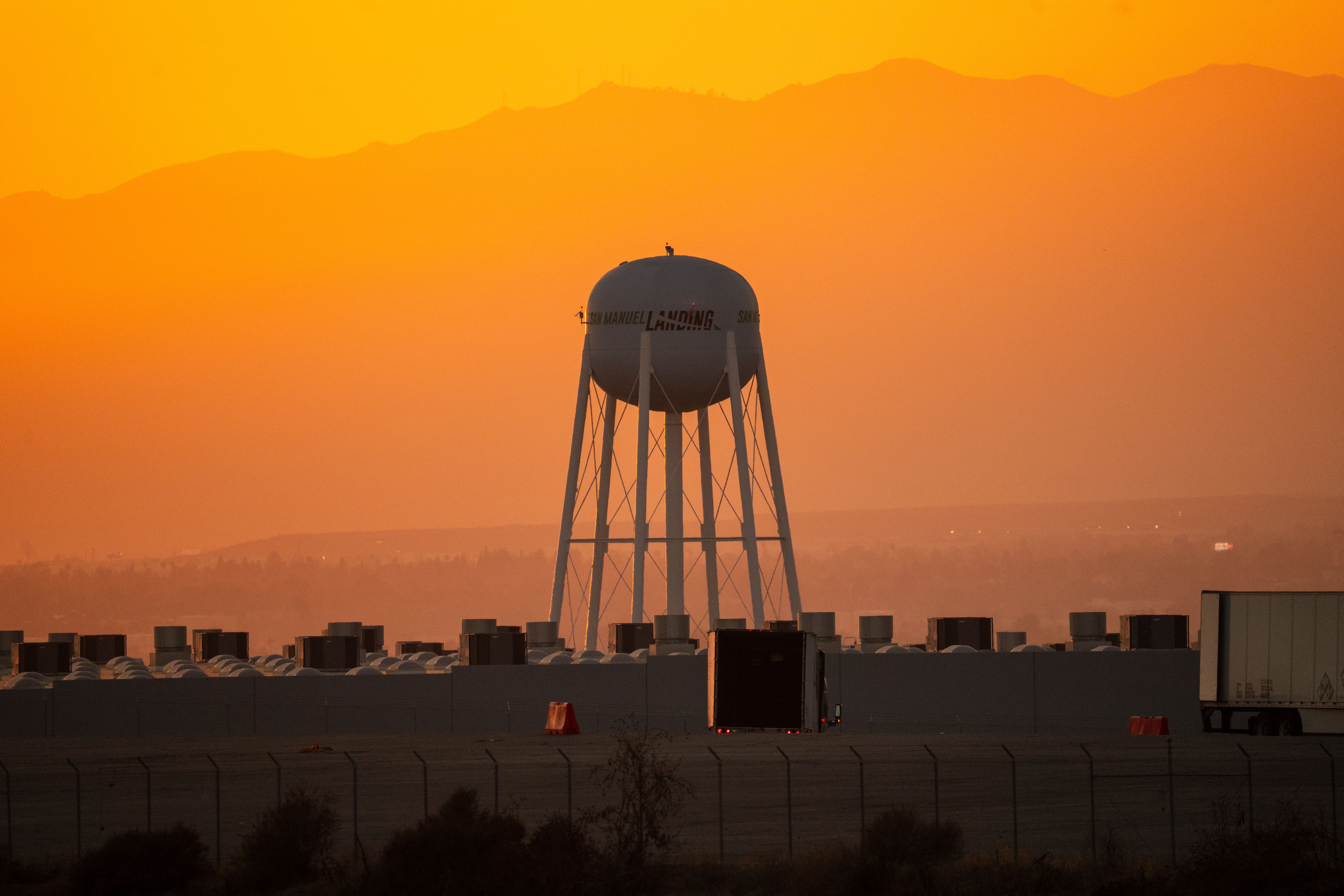 Scenic sunset view of a water tower and industrial area in California.