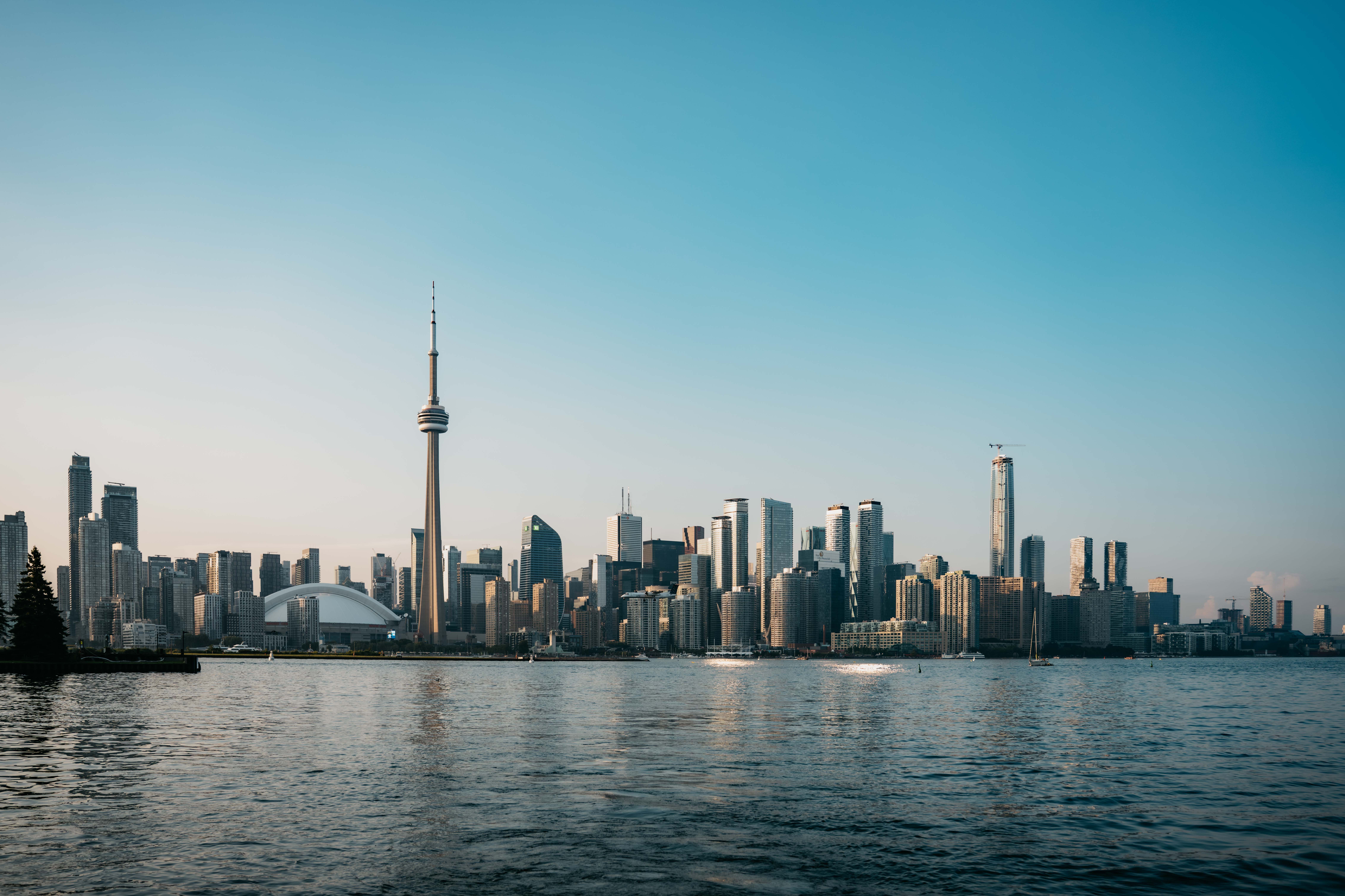Busy downtown Toronto street reflecting immigration and Canada's economy