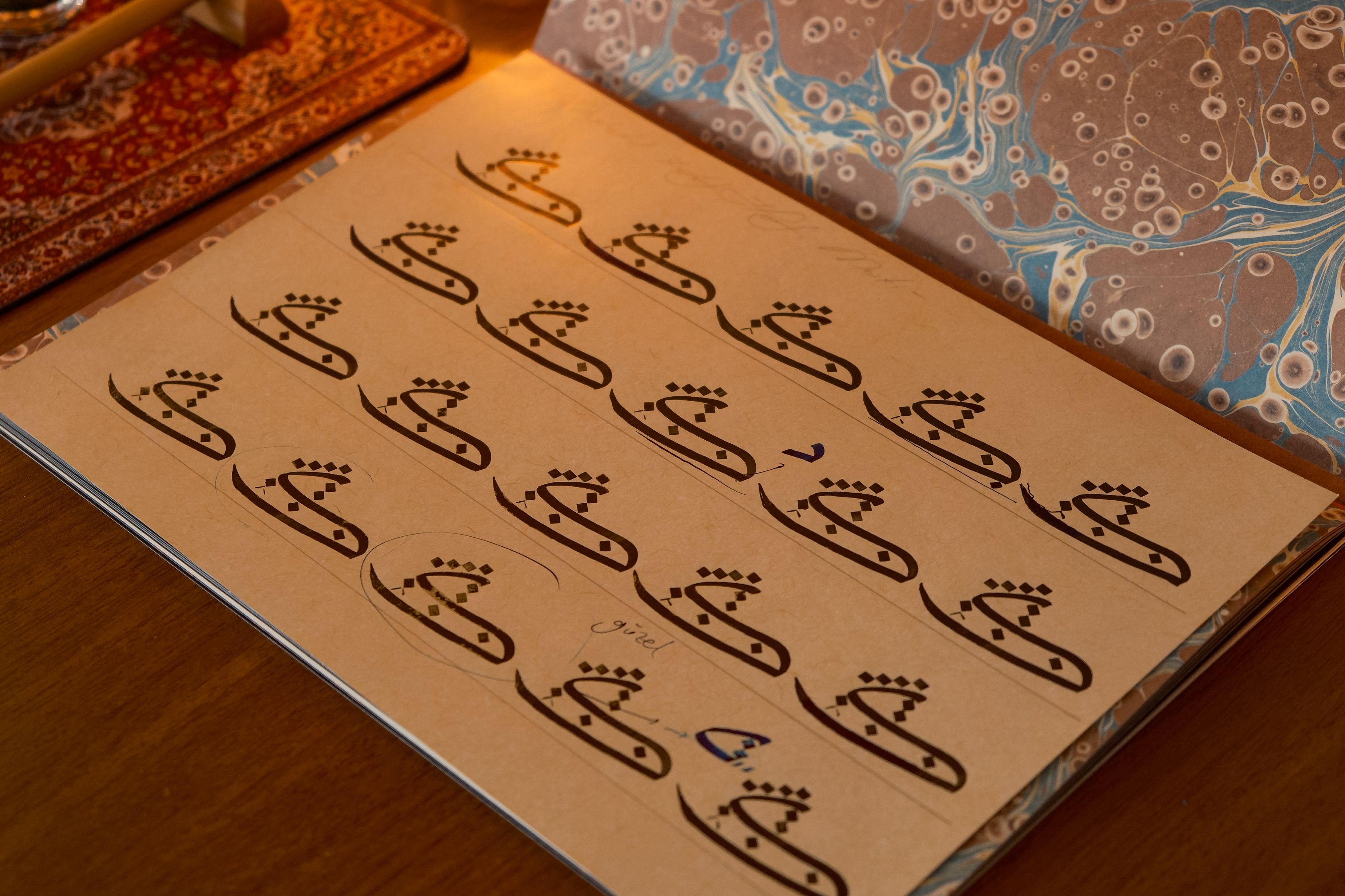 Beautifully crafted Arabic calligraphy art on paper showcasing traditional script style.