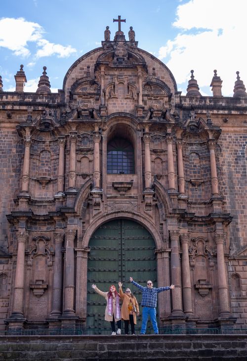 Free Tourists enjoy a sunny day at the entrance of the Cusco Cathedral in Peru. Stock Photo