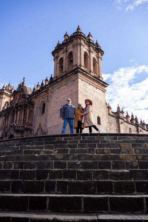 Free A group of tourists posing in front of the iconic Cusco Cathedral, Peru. Stock Photo