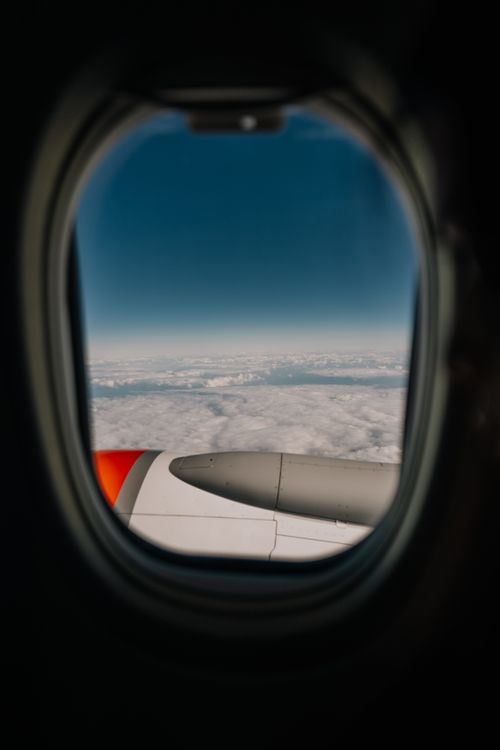 Free Aerial perspective from an airplane window showcasing stunning cloudy sky over New Zealand. Stock Photo
