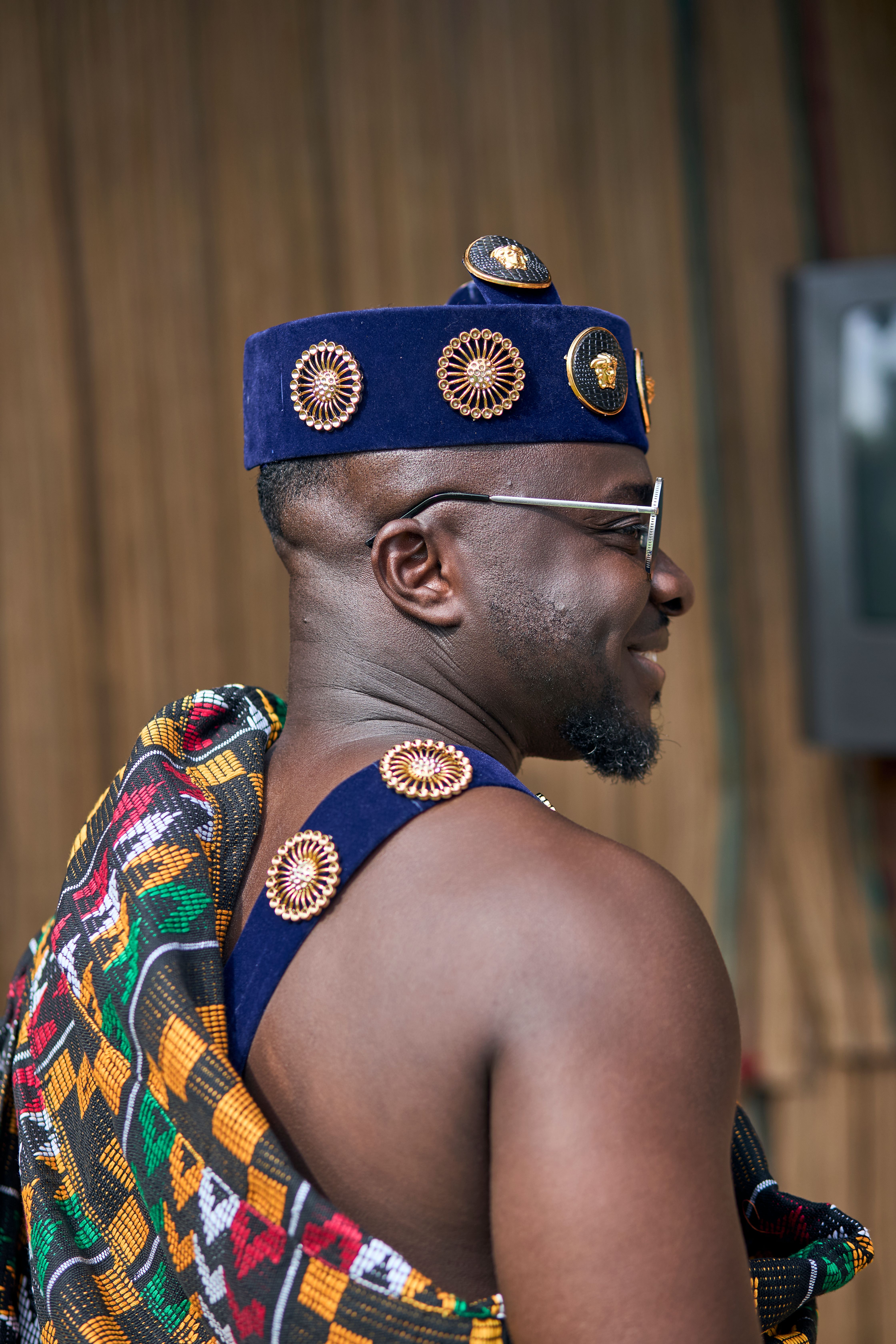 Captivating portrait of a man in traditional Ghanaian clothing, showcasing cultural heritage in Accra.