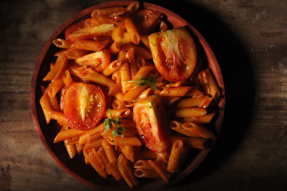 Photo by Jahra Tasfia Reza on Pexels A close-up of penne pasta with tomato sauce in a wooden bowl on a rustic table. - Photo by Jahra Tasfia Reza on Pexels