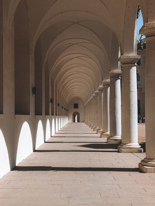 Free Symmetrical arches and columns in a sunlit Baroque arcade, Dresden, Germany. Stock Photo