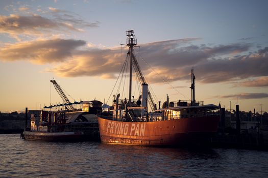 The Lightship Frying Pan docked at Pier 66, New York City during a beautiful sunset.