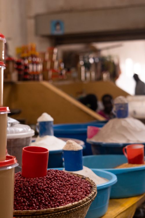 Free Colorful display of grains and pulses in a vibrant Ugandan market. Stock Photo