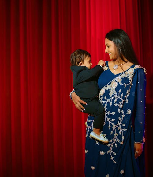 Free Woman Carrying A Baby Stock Photo