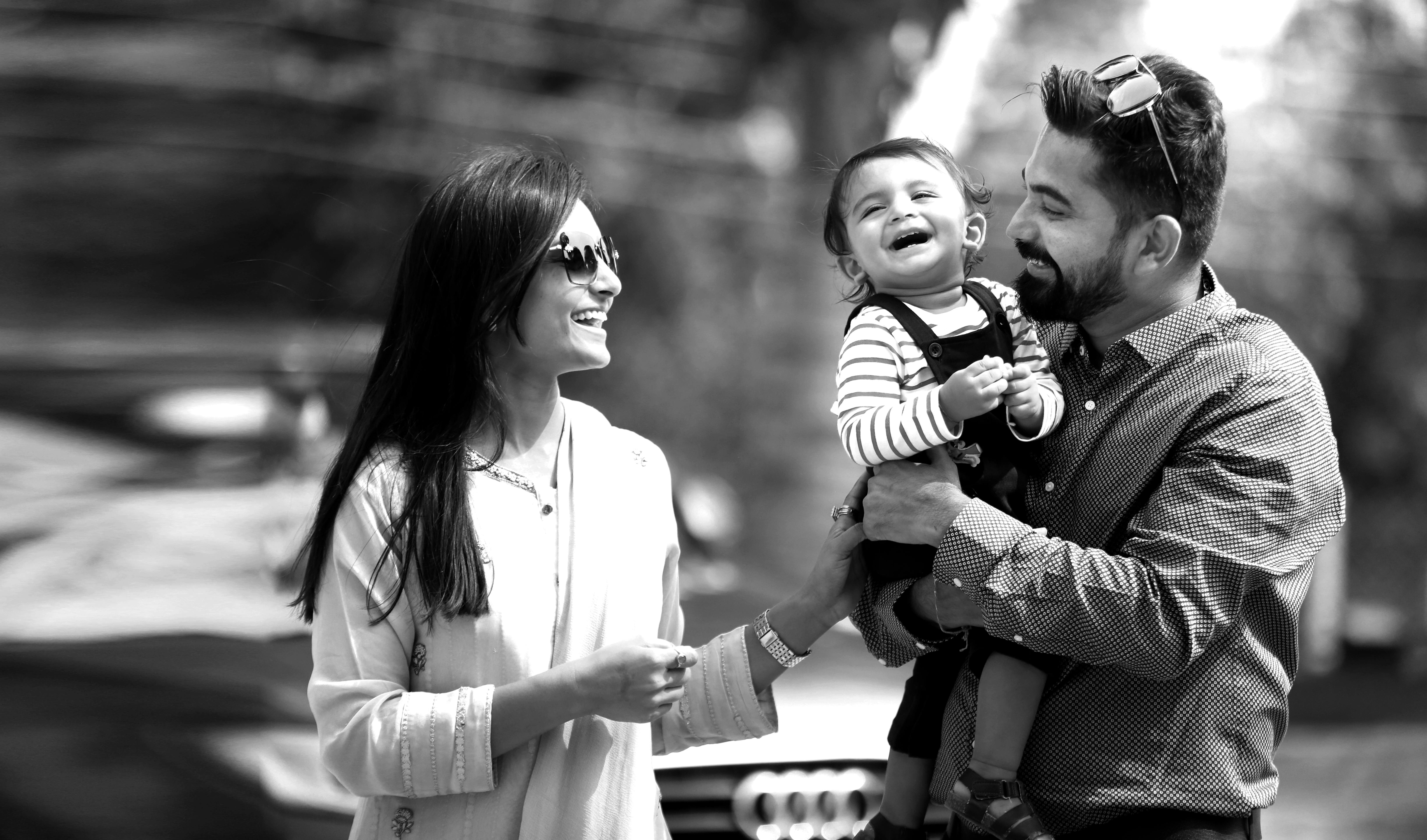 Man and Woman Holding a Child · Free Stock Photo