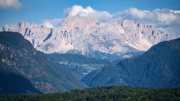 Breathtaking view of the Italian Alps under a clear blue sky in Trentino-Südtirol.