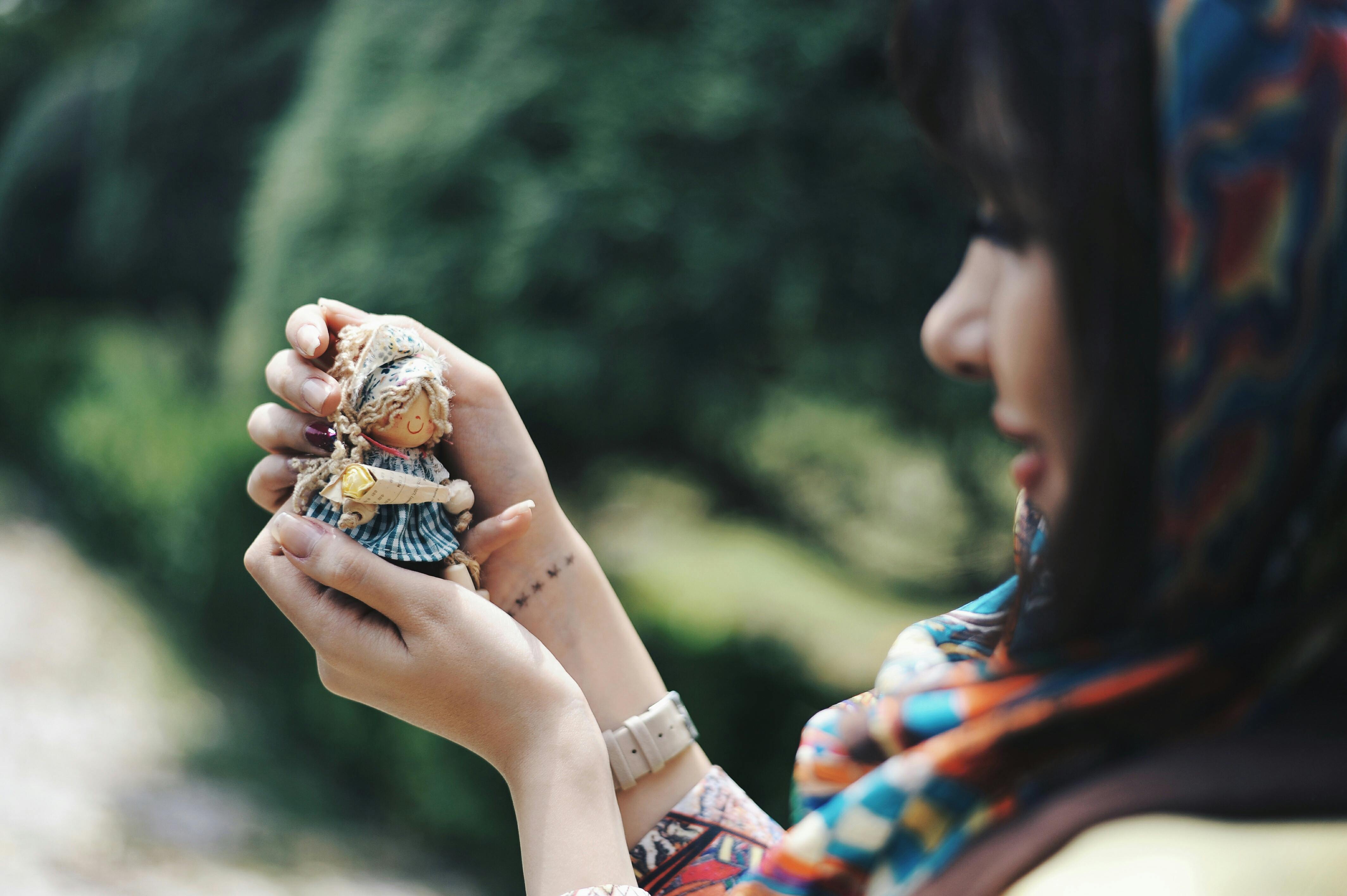 woman holding doll