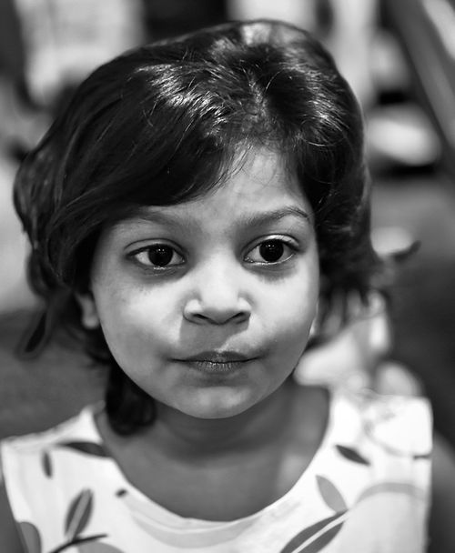 Free Black and white portrait of a young girl with thoughtful expression. Stock Photo