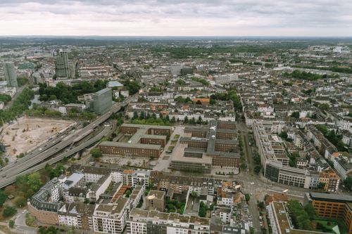 Free Explore the urban landscape of Düsseldorf with this stunning aerial cityscape, showcasing its architecture and greenery. Stock Photo