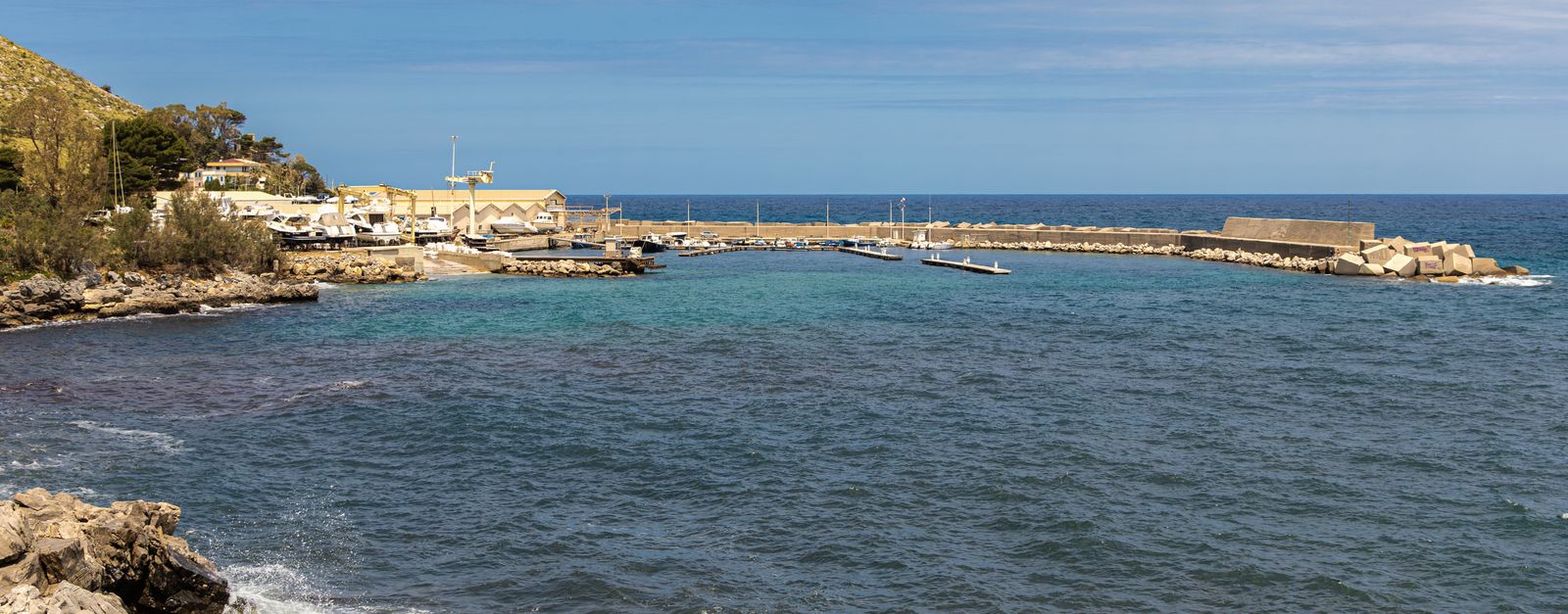 Scenic view of Cala di Palermo's coastline and harbor in Sicily, Italy.