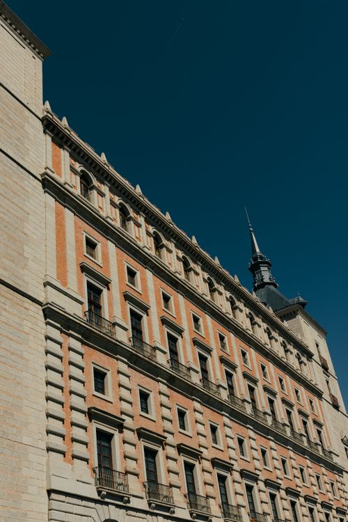Free Elegant classical architecture in Toledo, Castilla-La Mancha, captured under a clear blue sky. Stock Photo