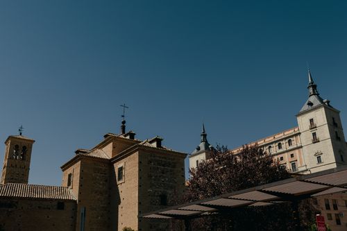 Free A scenic view of historic buildings in Toledo, Spain under a clear blue sky. Stock Photo