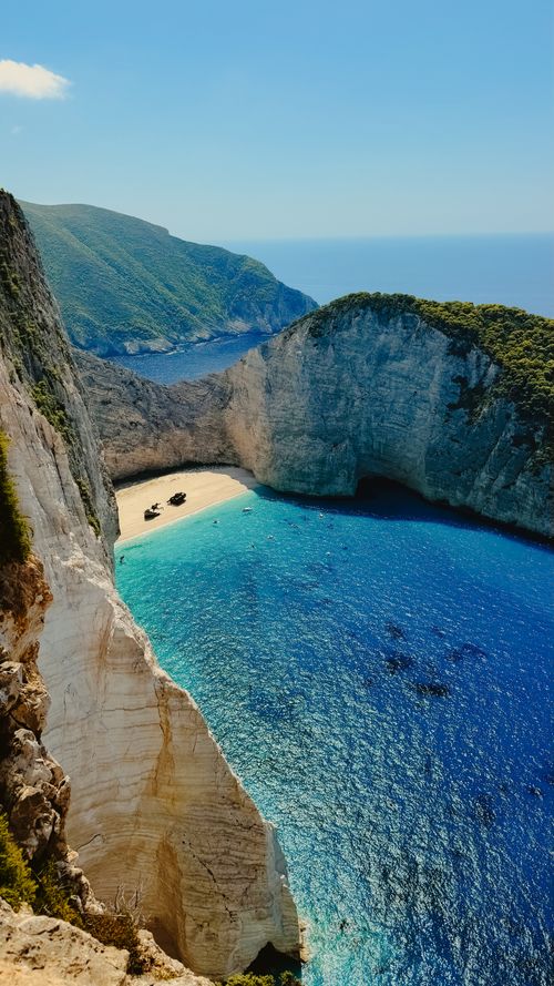 Free Stunning aerial view of Navagio Beach in Zakinthos, Greece, with turquoise waters and dramatic cliffs. Stock Photo