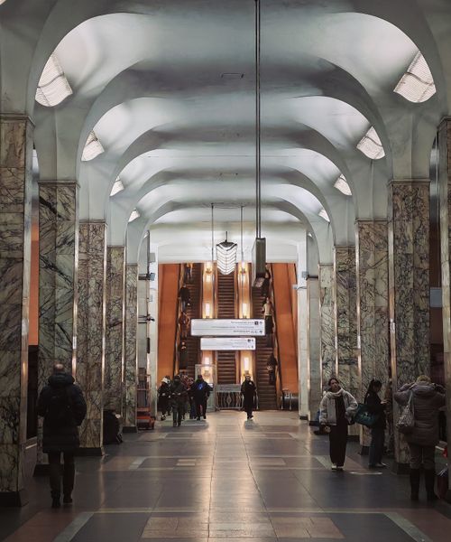 Free A busy view of a Moscow metro station with people and elegant marble columns. Stock Photo