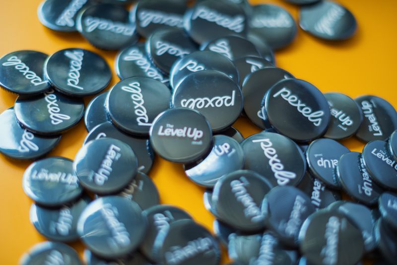 Branded button badges arranged for promotional giveaways
