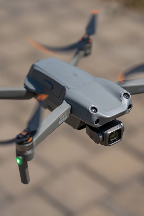 Free High-resolution close-up of a modern drone with spinning propellers outdoors. Stock Photo