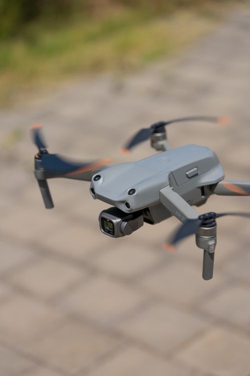 Free Close-up of a modern drone flying outdoors on a sunny day, showcasing technology in action. Stock Photo
