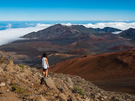 Photo by James Wheeler Woman hiking in Haleakalā National Park, enjoying scenic volcanic landscape in Maui, Hawaii.