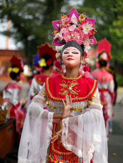 Free Portrait of a traditional Indonesian dancer in vibrant costume during a cultural event in Jakarta. Stock Photo