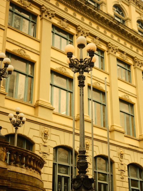 Free A classic view of historic architecture featuring ornate facades and street lamps in Rio de Janeiro, Brazil. Stock Photo
