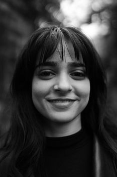 Captivating black and white portrait of a young woman smiling warmly. - Fotografer Sidoarjo
