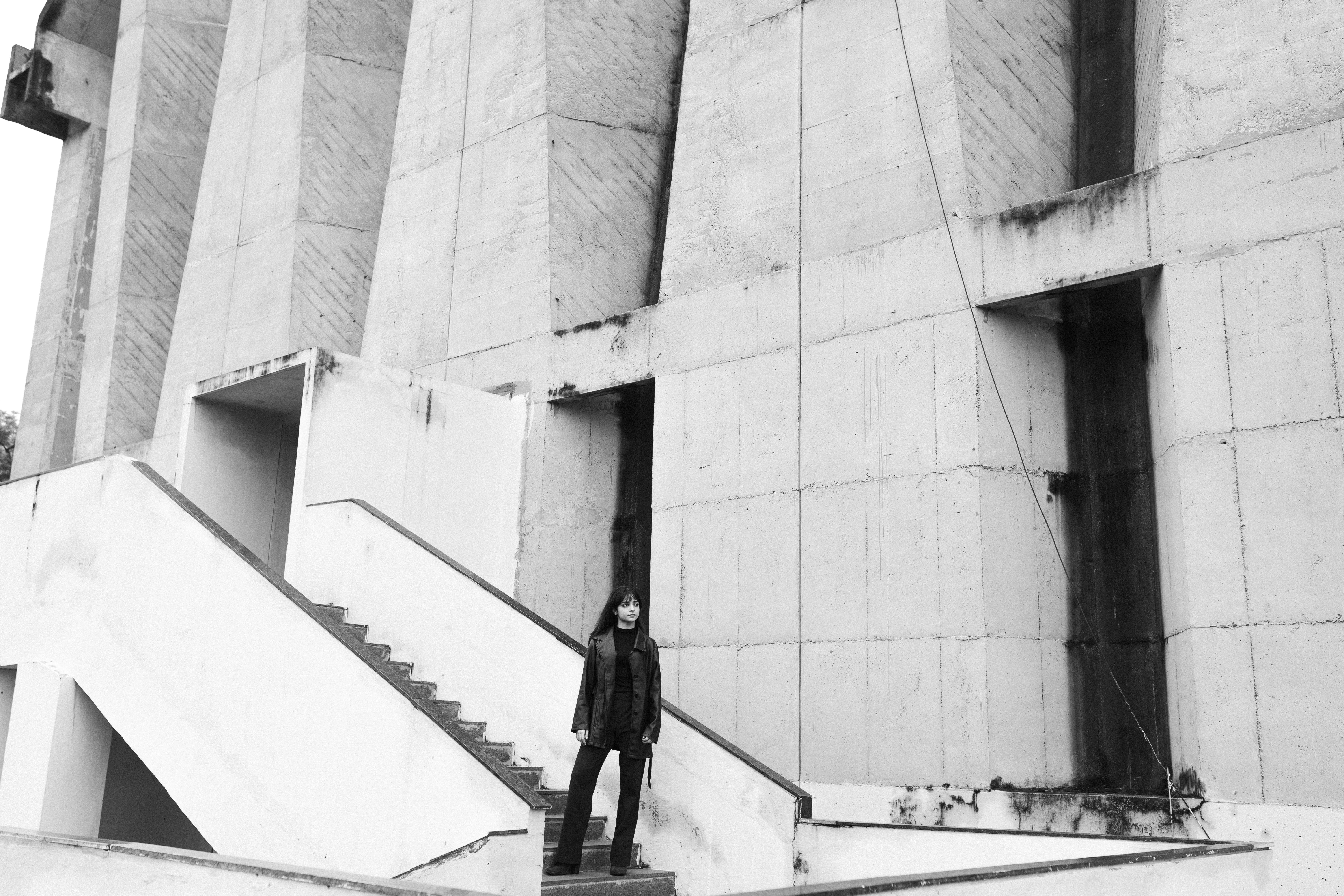 Raw brutalist concrete wall with deep texture