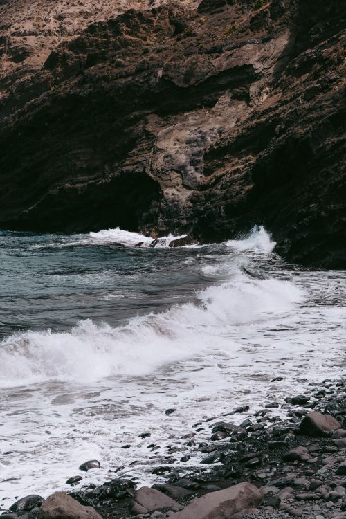 Free Explore the rugged volcanic coastline and crashing waves of Hermigua, Canary Islands, Spain. Stock Photo