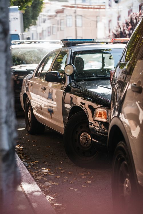 Free A police car parked on a street in San Francisco, California, USA. Stock Photo