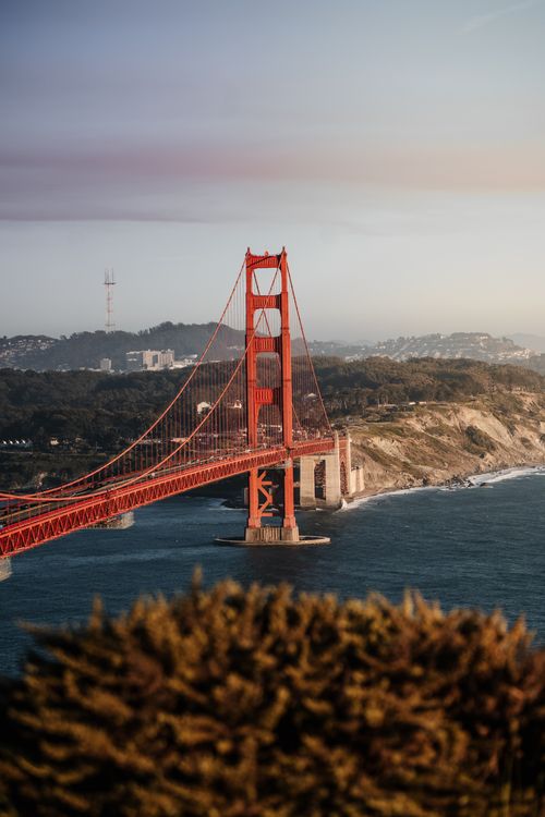 Free A stunning view of the Golden Gate Bridge during sunset in San Francisco. Iconic landmark with scenic background. Stock Photo