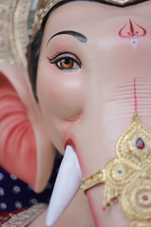 Free Detailed close-up of a Ganesha idol showcasing ornate designs and vibrant colors. Stock Photo
