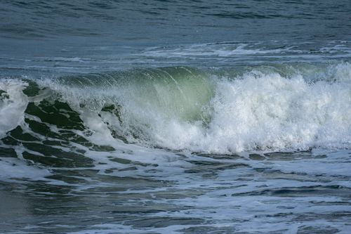 Free Dynamic view of a crashing wave with seafoam on the Mediterranean coast in Cullera, Spain. Stock Photo