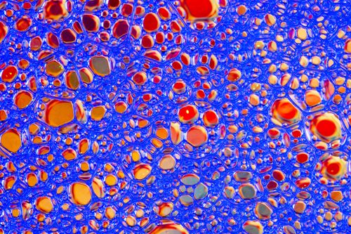 Free Dynamic and colorful abstract art featuring intricate soap bubble patterns in vivid colors. Stock Photo