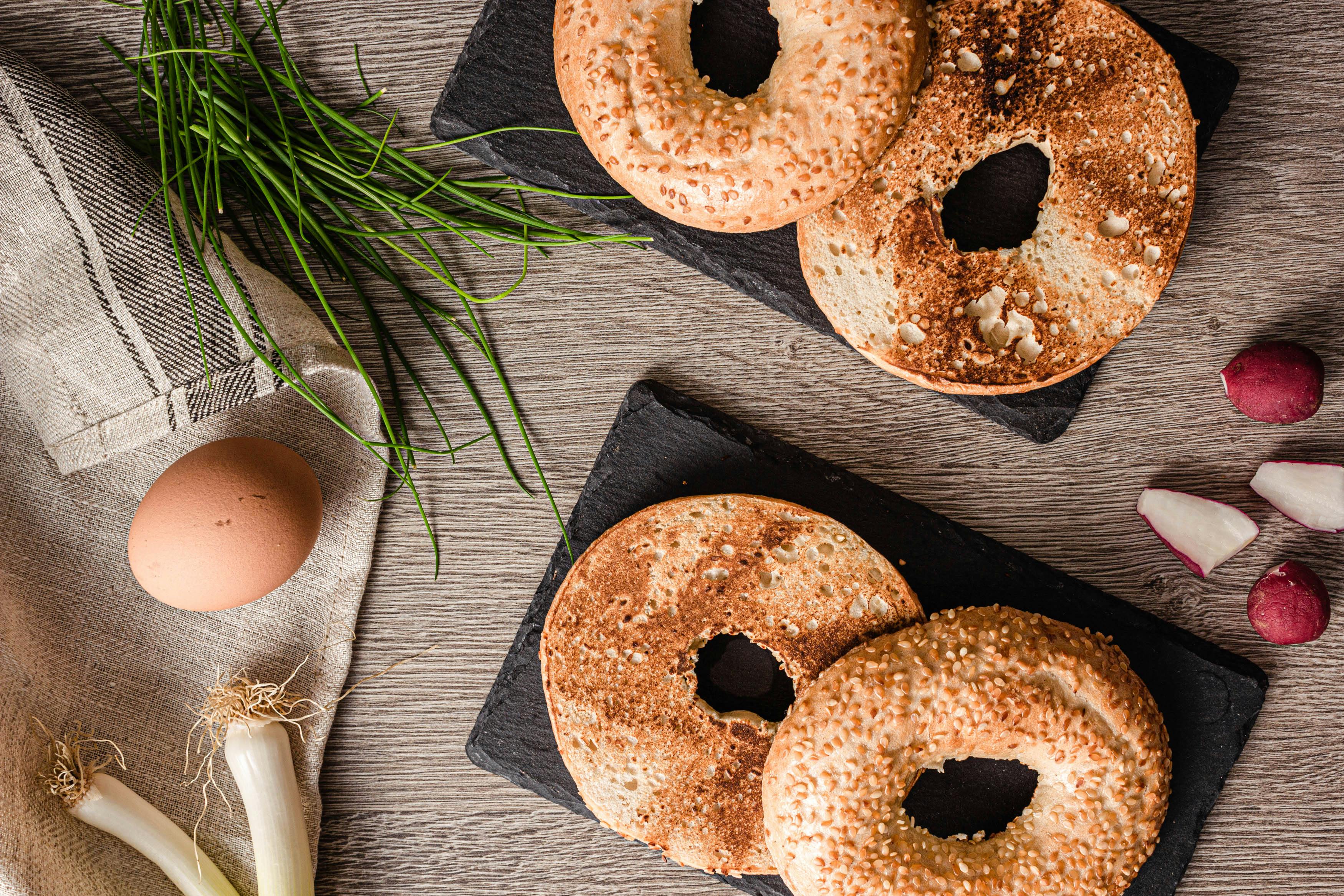 Bagels On Black Plates · Free Stock Photo