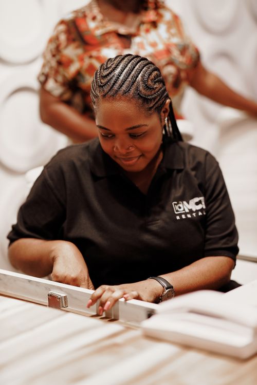 Free Focused woman measuring a board during a workshop task indoors. Stock Photo