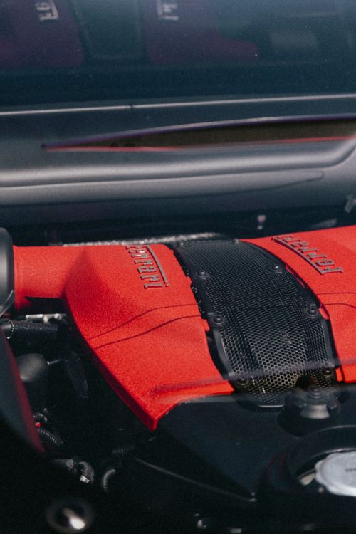 Free Detailed view of a red engine in a high-performance sports car, showcasing design and engineering. Stock Photo