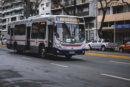 Free Public bus navigating through a street in Montevideo, Uruguay. Stock Photo