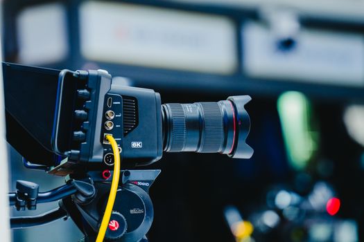 Close-up shot of a professional 6K video camera mounted on a tripod, ideal for filming and video production. - Fotografer Sidoarjo