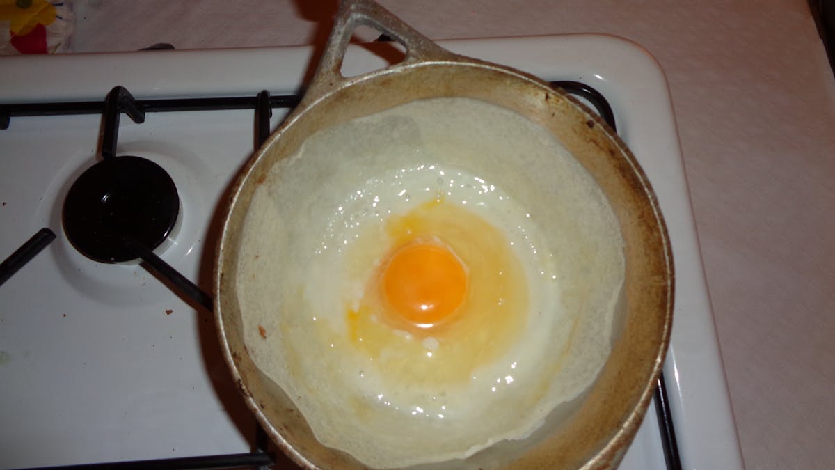 Close-up of diverse people placing their hands together in a supportive circle
